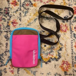 Pink, blue and brown Lululemon crossbody bag.
